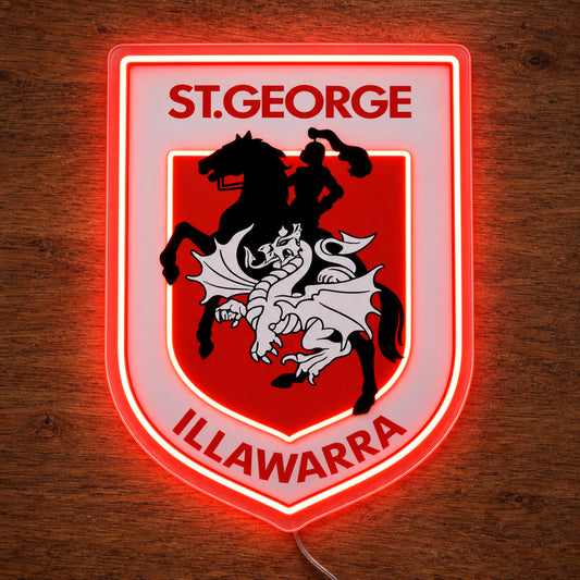St George Illawarra Dragons neon sign glowing brightly on a wooden surface in dim lighting