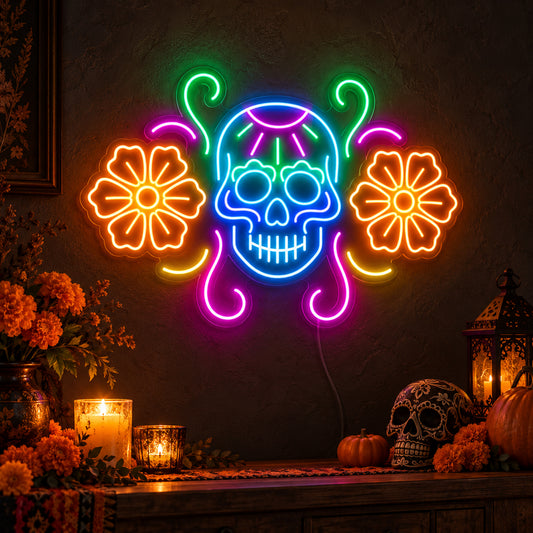 Sugar Skull with Flowers Neon Sign featuring a blue sugar skull flanked by orange flowers, with pink and green decorative curves, glowing on a dark wall in a Halloween room display.