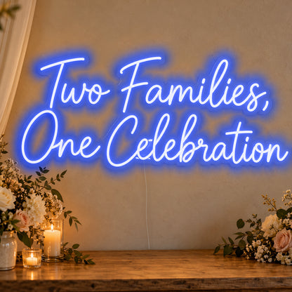 Two Families One Celebration Neon Sign in blue LED neon on clear acrylic, angled view