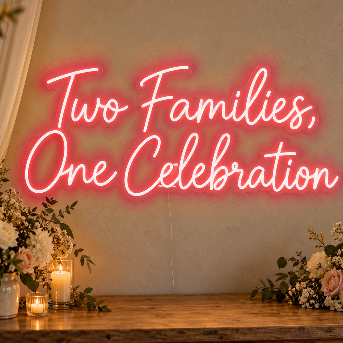 Two Families One Celebration Neon Sign in red LED neon on clear acrylic, angled view