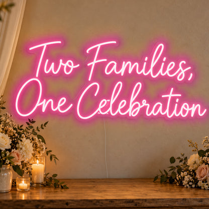 Two Families One Celebration Neon Sign in rose red LED neon on clear acrylic, angled view