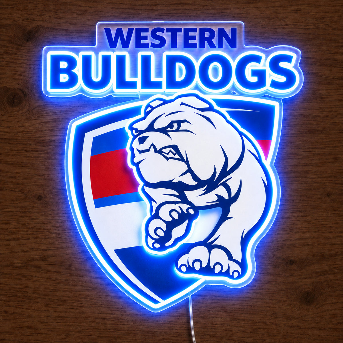 Western Bulldogs neon sign glowing brightly on a wooden surface in dim lighting