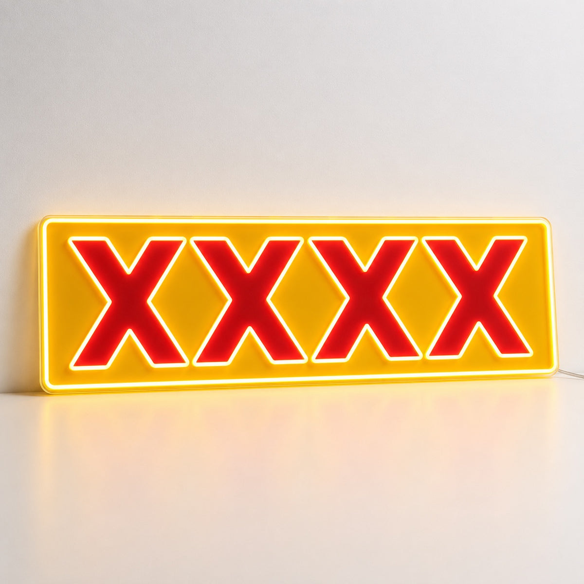 XXXX Beer Neon Sign with red XXXX lettering, illuminated outlines and yellow rectangular backing